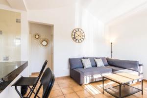 a living room with a couch and a table at Casa Bodega Coco in Puerto del Carmen