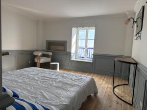 a bedroom with a bed and a window at Mado by Scoop in Le Crotoy +6 photos