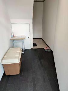an empty room with a table and a door at 梅田 天王寺へ電車一本 福宿平野 in Osaka +3 photos