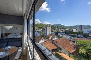a room with a view of the city at Edificio ON in Blumenau