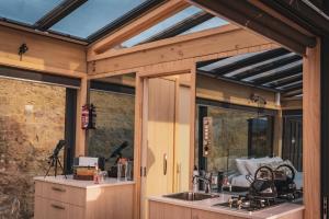 a house with a kitchen with a glass roof at Tāima PurePod in Cromwell