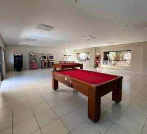 a large room with a pool table in it at Boulevard suíte hotel suíte 1220 in Caldas Novas