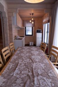 a kitchen with a large table in a room at MATRYOSHKA HOUSE in Yoichi