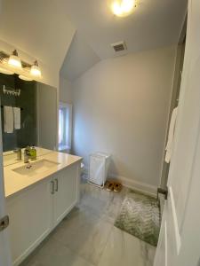 a bathroom with a sink and a mirror at B-Willowdale Cummer Residence -Queen bedroom near Yonge-Finch in Toronto +7 photos