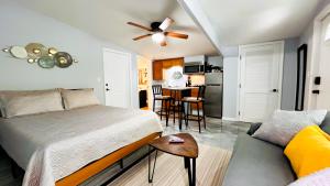 a bedroom with a bed and a couch at The Perfect One Night Stay in Jacksonville