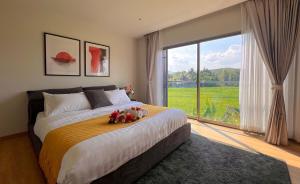 a bedroom with a large bed with teddy bears on it at Maerim Luxury 3BR Pool Villa with Mountain View in Ban Tai