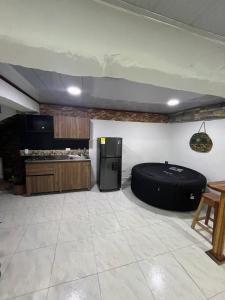 a kitchen with a black bean bag bed in a room at Apartamento de lujo con jacuzzi en Jericó in Jericó +13 photos