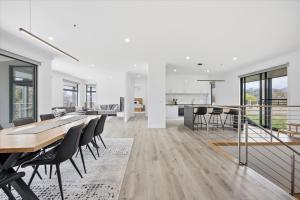 a dining room and kitchen with a table and chairs at Eildon Valley Views in Eildon