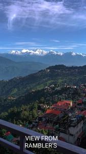 a view of a mountain range with snow covered mountains at Homestay in Darjeeling By NE DEN in Jāmb +6 photos