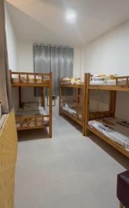 a room with three bunk beds in a room at View Deck Private Pool in De La Paz +22 photos
