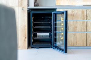 an oven with its door open in a kitchen at Villa CASK Setouchi in Mitoyo