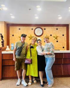 a group of people standing in front of a counter at Media Nha Trang Hotel in Nha Trang +182 photos