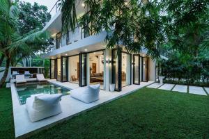 an exterior view of a villa with a swimming pool at Terra Villas in Ahangama