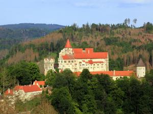 a large castle sitting on top of a hill at Villa in Býšovec near Harusak Ski Resort in Ujčov