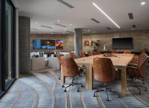 a conference room with a large wooden table and chairs at Alila Marea Beach Resort Encinitas, a Hyatt Resort in Encinitas