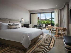 a bedroom with a bed and a living room at Alila Marea Beach Resort Encinitas, a Hyatt Resort in Encinitas +131 photos