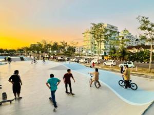 a group of people skateboarding at a skate park at Santorini Hotel in Miri