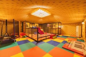 a childrens room with a bunk bed in a room at Brij Bageecha, Jaipur - IHCL SeleQtions in Jaipur