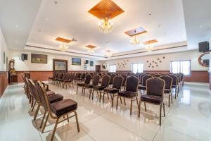 a room with a bunch of chairs and a podium at Treebo Premium Silva Lux in Wayanad