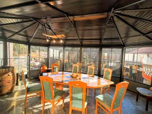 a dining room with a table and chairs at Guest House Milka in Yagodina