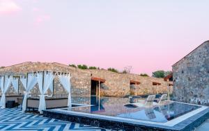 a resort with a swimming pool and a building at Brij Bageecha, Jaipur - IHCL SeleQtions in Jaipur
