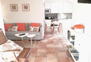 a living room with a couch and a table at alaia apartamento in Zarautz +33 photos
