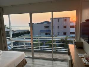 a hotel room with a view of the ocean at Nantra Hua Hin in Hua Hin