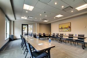 a conference room with long tables and chairs at Hyatt House Chicago/Evanston in Evanston