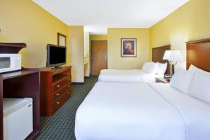 a hotel room with two beds and a flat screen tv at Quality Inn Marshall near I-69 in Marshall +14 photos