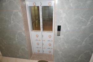 a shower door in a bathroom with at Hotel JR Palace- Near Toran Dwar and free Parking in Khātu +66 photos