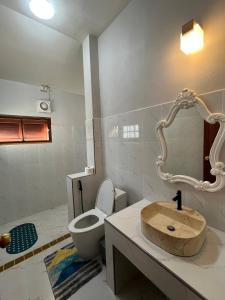 a bathroom with a sink and a toilet at พรพนาฮิล4 in Lamphun