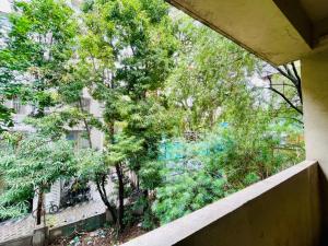a view from a balcony of a building with trees at Flora 2bhk Kothrud MIT WPU in Pune