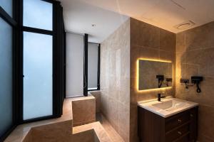 a bathroom with a sink and a mirror at The Green Hall in George Town +134 photos