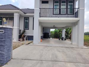 a house being remodeled with a porch and a driveway at Miqayla Homestay in Wakaf Baharu