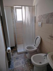 a bathroom with a toilet and a shower and a sink at L'antica Terrazzella in Vasto +22 photos