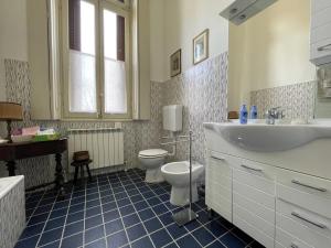 a bathroom with a sink and a toilet in it at Villa Cervi in Ronco Todeschino +62 photos