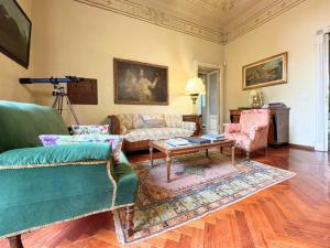 a living room with a couch and a table at Villa Cervi in Ronco Todeschino
