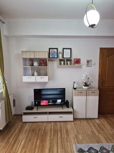 a living room with a flat screen tv at Fine Rest- Spacious & Cozy Apartment in Brčko