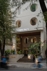 a building with a staircase in front of it at MEANDER Saigon in Ho Chi Minh City