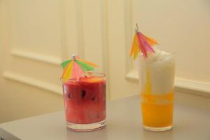 two cocktails sitting on top of a table at Executive-Studio-Apartmen in Nairobi