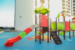 a playground with colorful slides and a slide at Executive-Studio-Apartmen in Nairobi