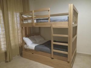 a couple of bunk beds in a room at Marakunda - Victoria in Jinja