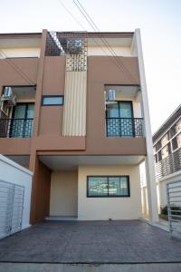 a house with a driveway in front of it at Vera Cozy Stay 2 in Ban Zong Katiam