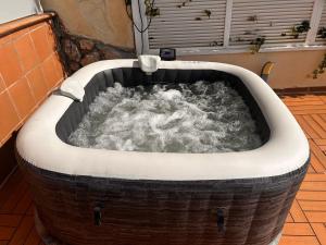 a jacuzzi tub filled with water at BEACH HOUSE. CASA CON PISCINA PRIVADA in Calafell