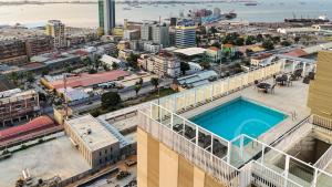 an overhead view of a city with a swimming pool at Edifício Kings Tower T2-02 in Luanda