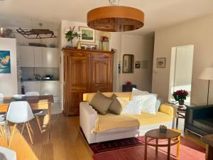 a living room with a couch and a table at Vache Mystique in Orsières