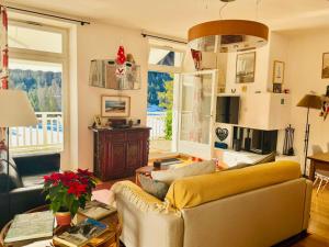 a living room with a couch and a table at Vache Mystique in Orsières