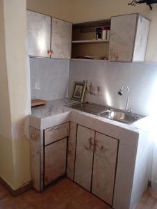 a kitchen with a sink and a counter top at Longonot View Camp and Accommodation, Naivasha in Naivasha +50 photos