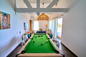 a living room with a pool table in it at Only4view - Rooftop & spa Sainte-Anne in Sainte-Anne