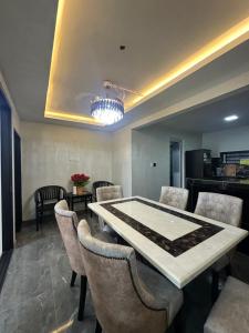 a dining room with a table and chairs at AH Homes Kulai in Kulai